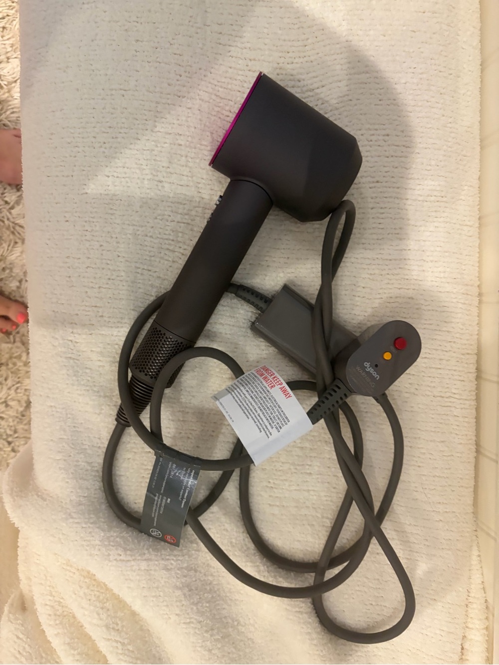 Dyson Hair Dryer in Charcoal Gray with Fuchsia Rim